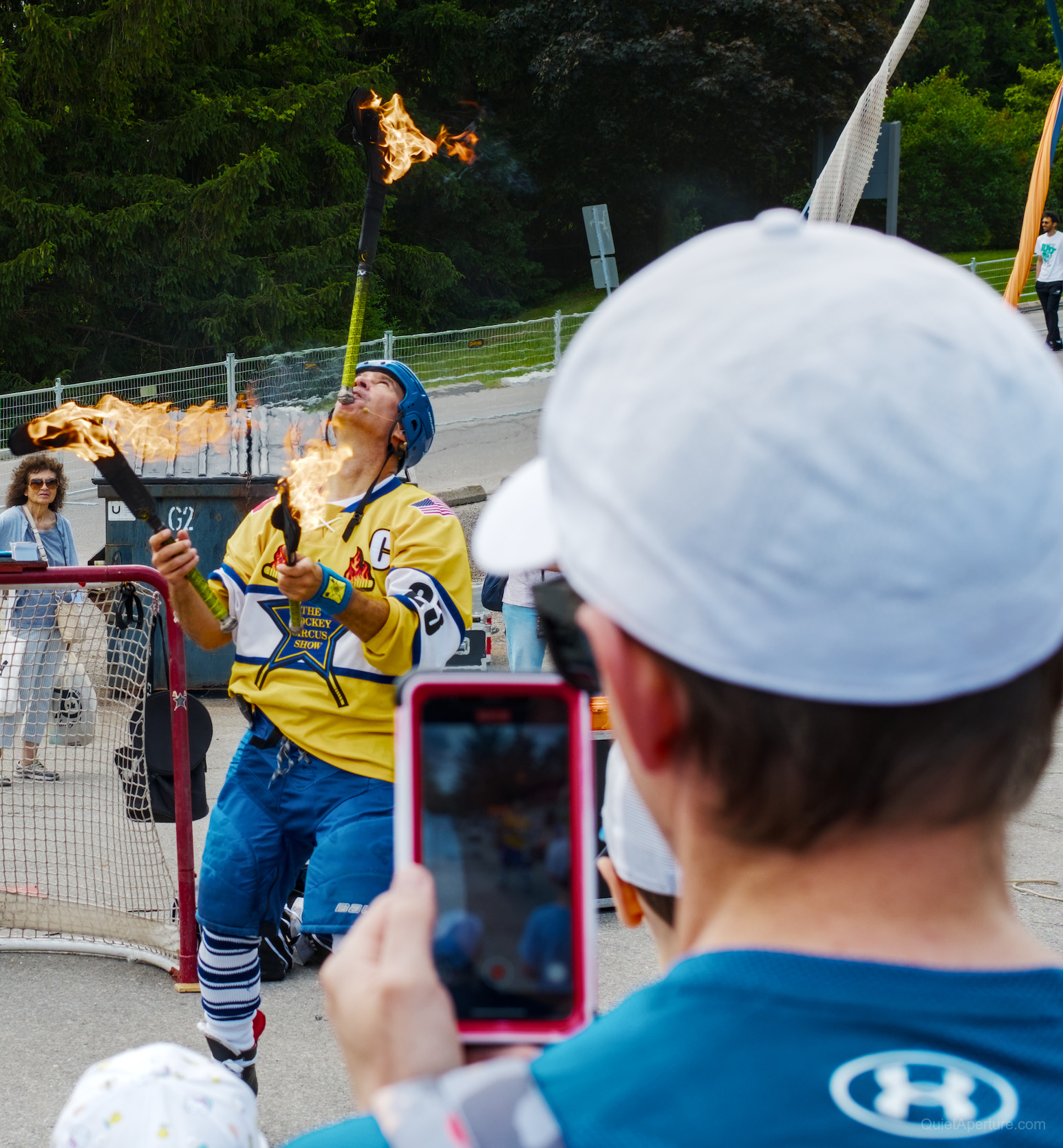 A hockey circus performer breathing fire at the Bread & Honey Festival, frame 01.